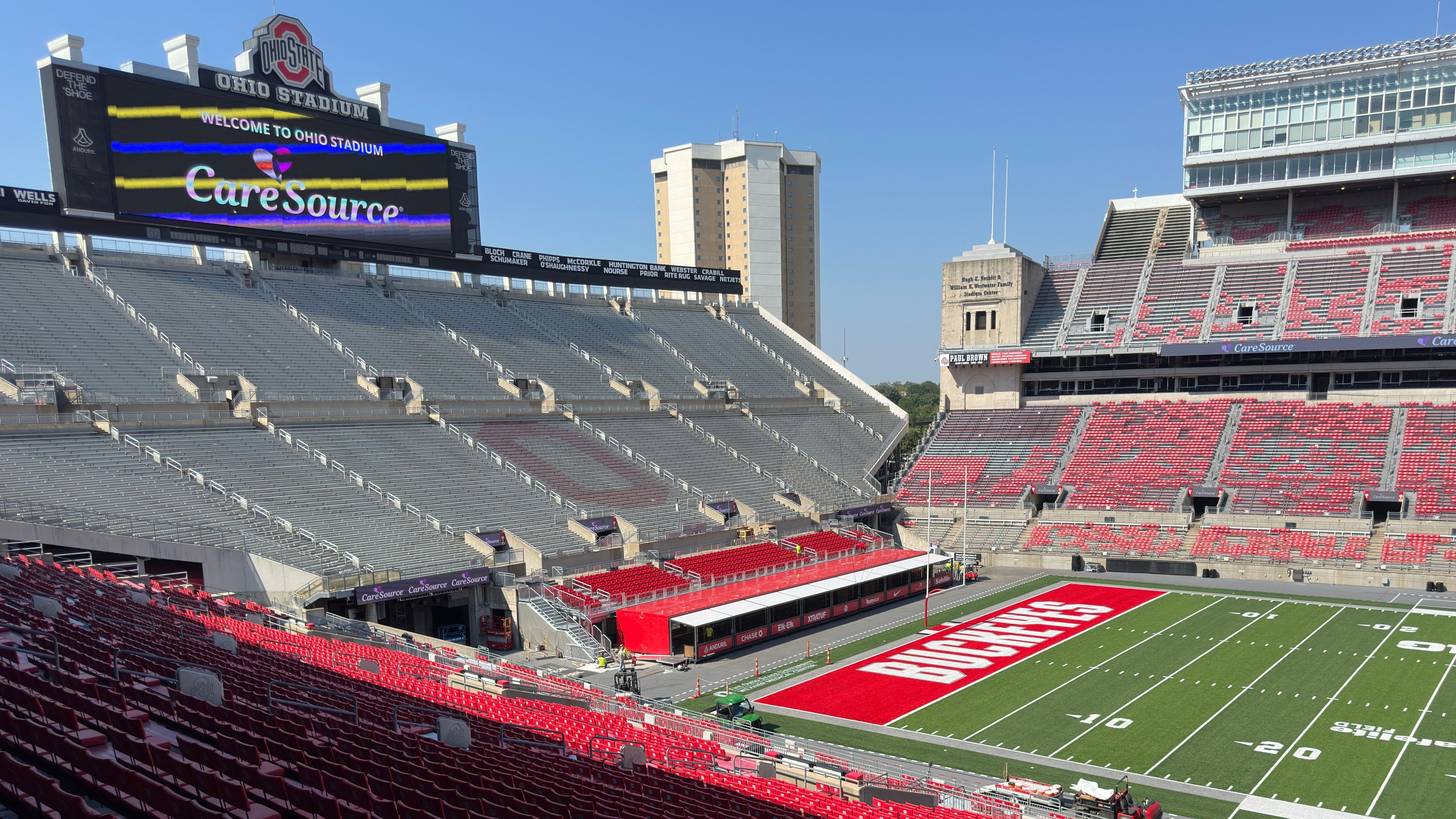 Angled stadium view showing the VIP suite row beside the field