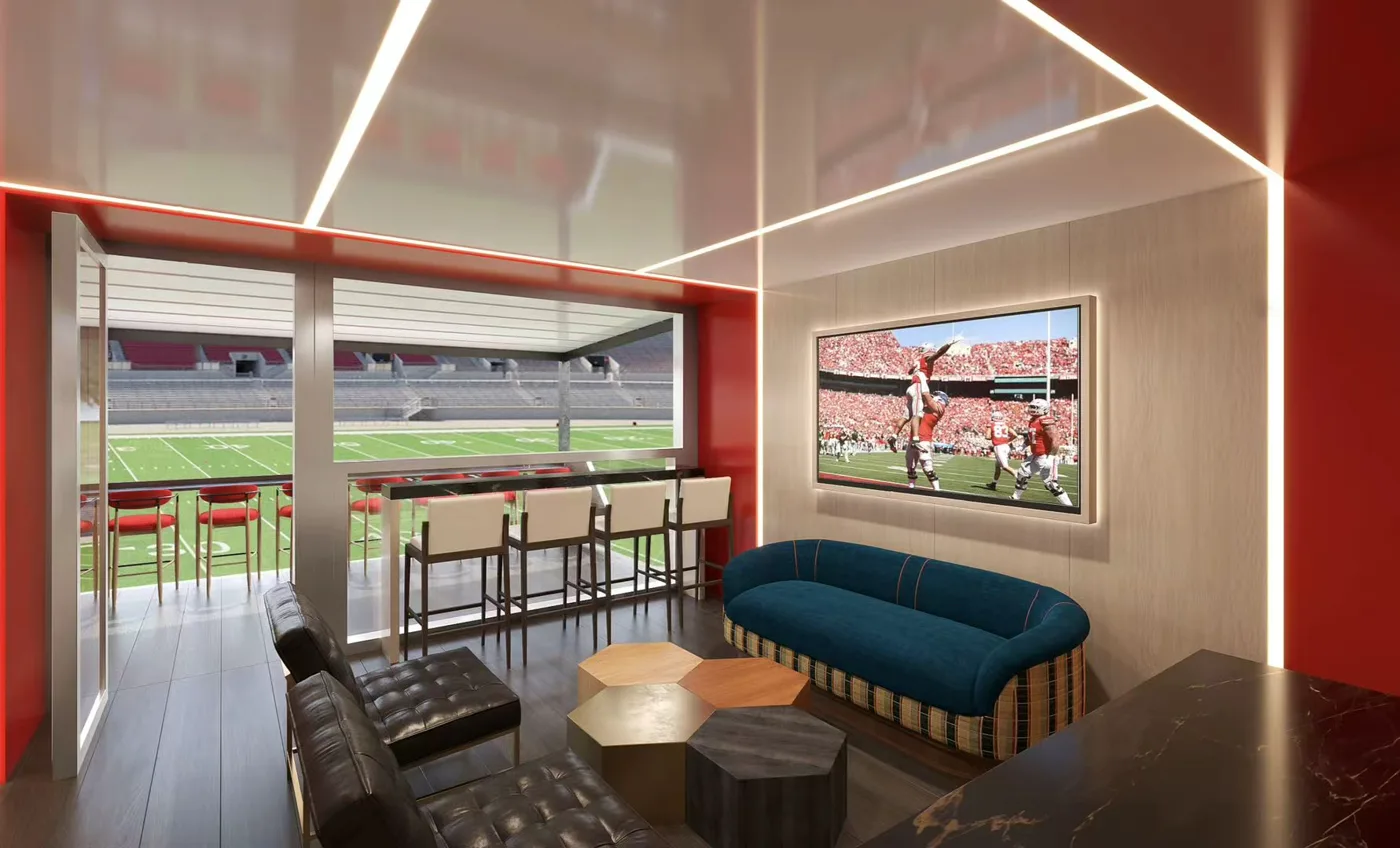 Style C VIP lounge with seating and an open stadium-facing viewing window